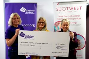 Scotwest presenting Alzheimer Scotland with £5,000 cheque